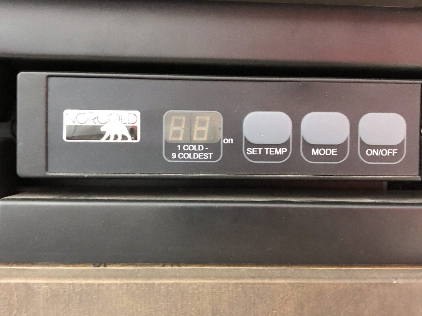 Closeup of an RV fridge control panel