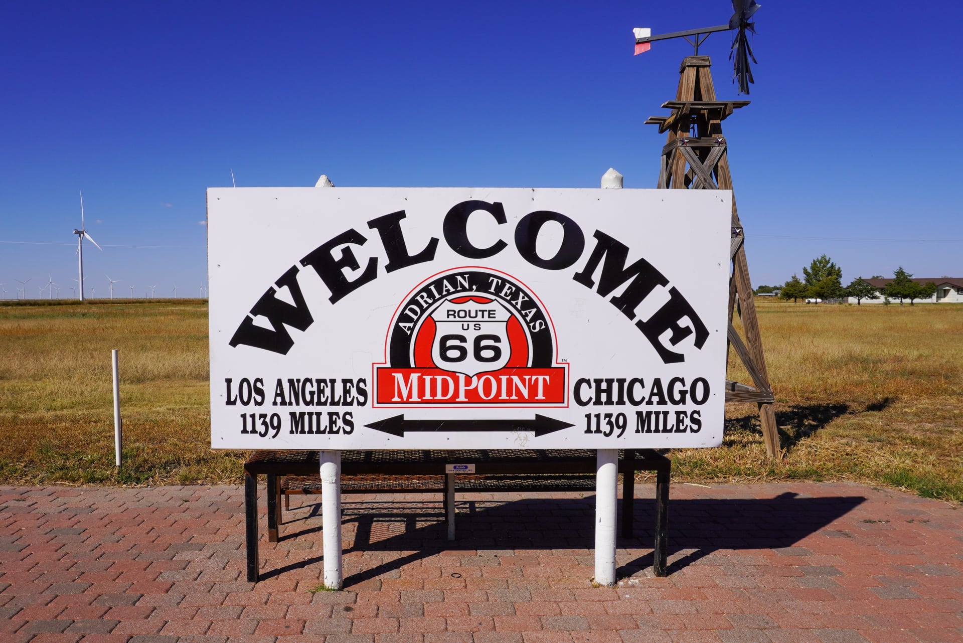 A welcome sign for the Route 66 midpoint